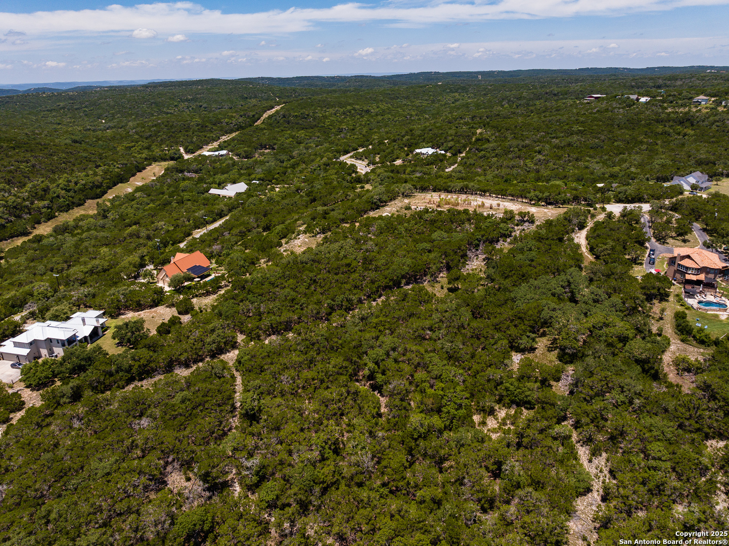Tbd Pr 177 Helotes, TX 78023 - Photo 26 of 34 an aerial view of residential houses with outdoor space and trees