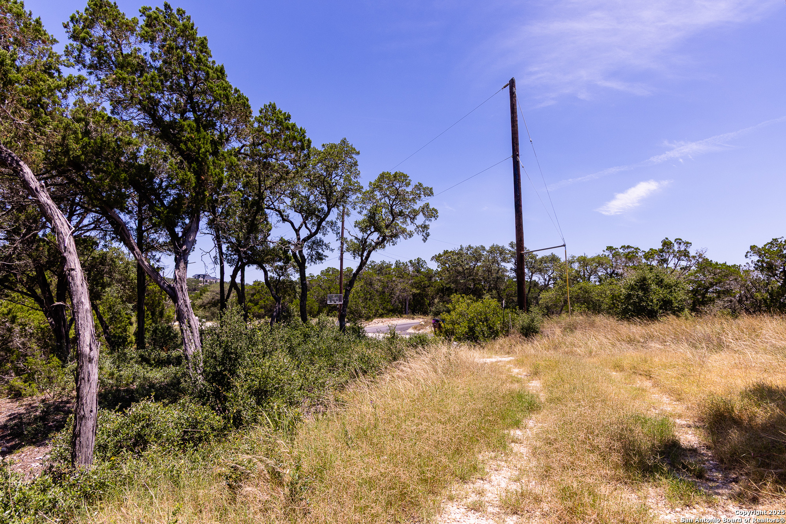 Tbd Pr 177 Helotes, TX 78023 - Photo 4 of 34 a view of a lake with a tree in the background