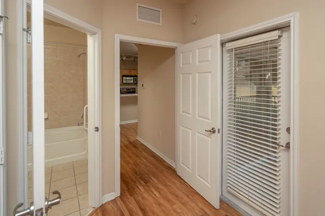 a view of a bathroom from the hallway