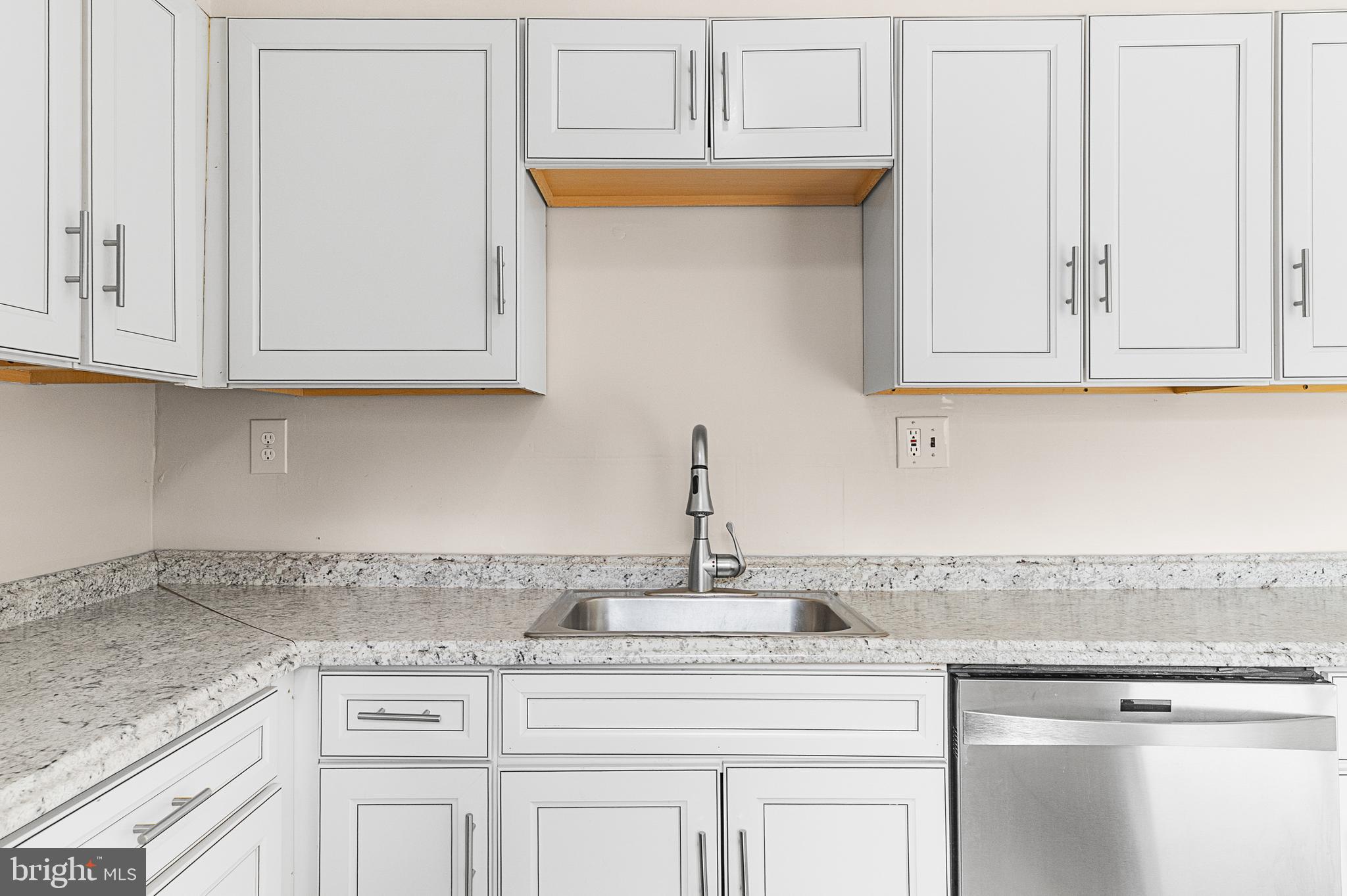 5 Dover Drive Lindenwold, NJ 08021 - Photo 14 of 28 a kitchen with granite countertop white cabinets and a sink
