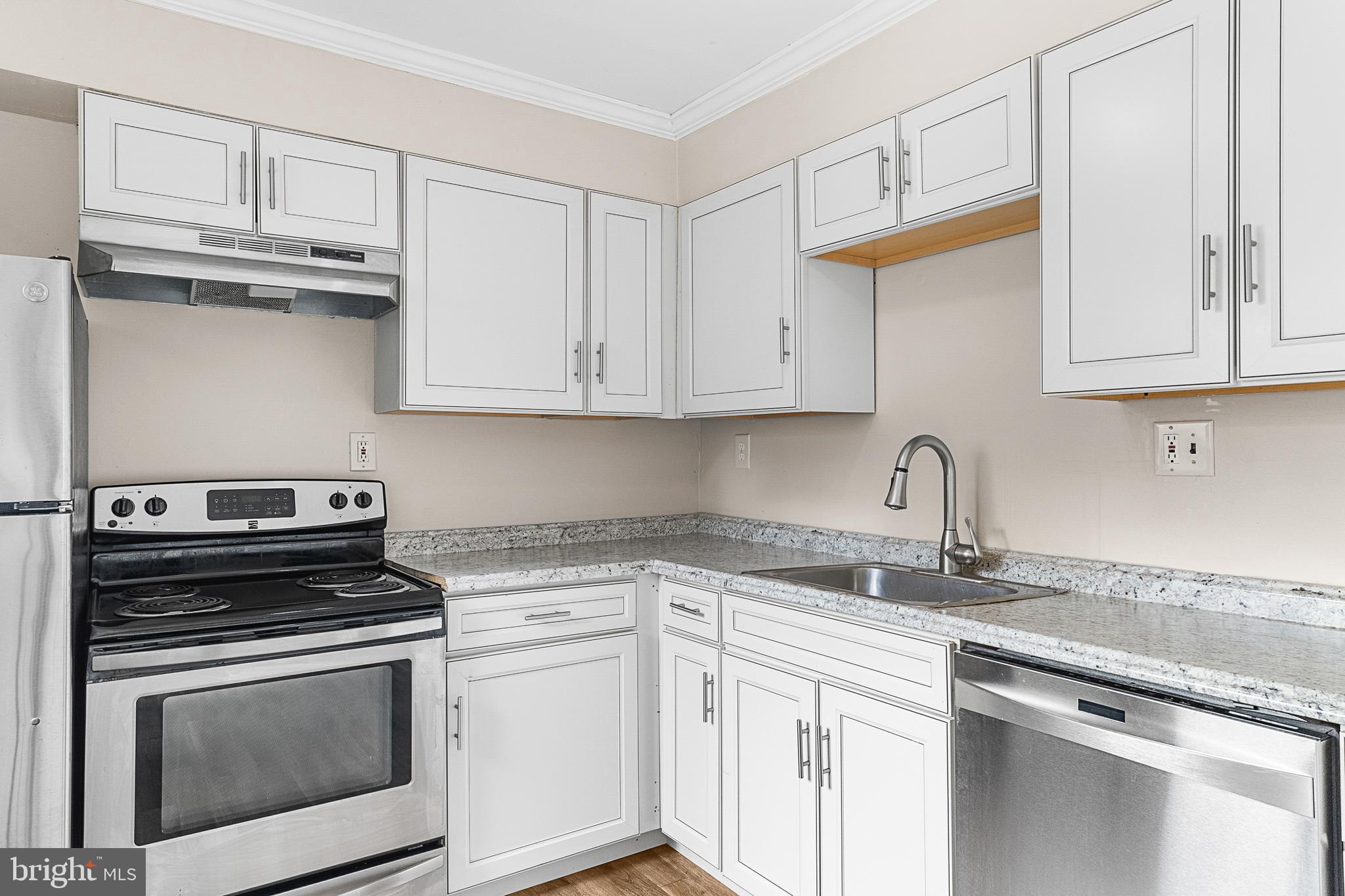 5 Dover Drive Lindenwold, NJ 08021 - Photo 15 of 28 a kitchen with granite countertop white cabinets and stainless steel appliances