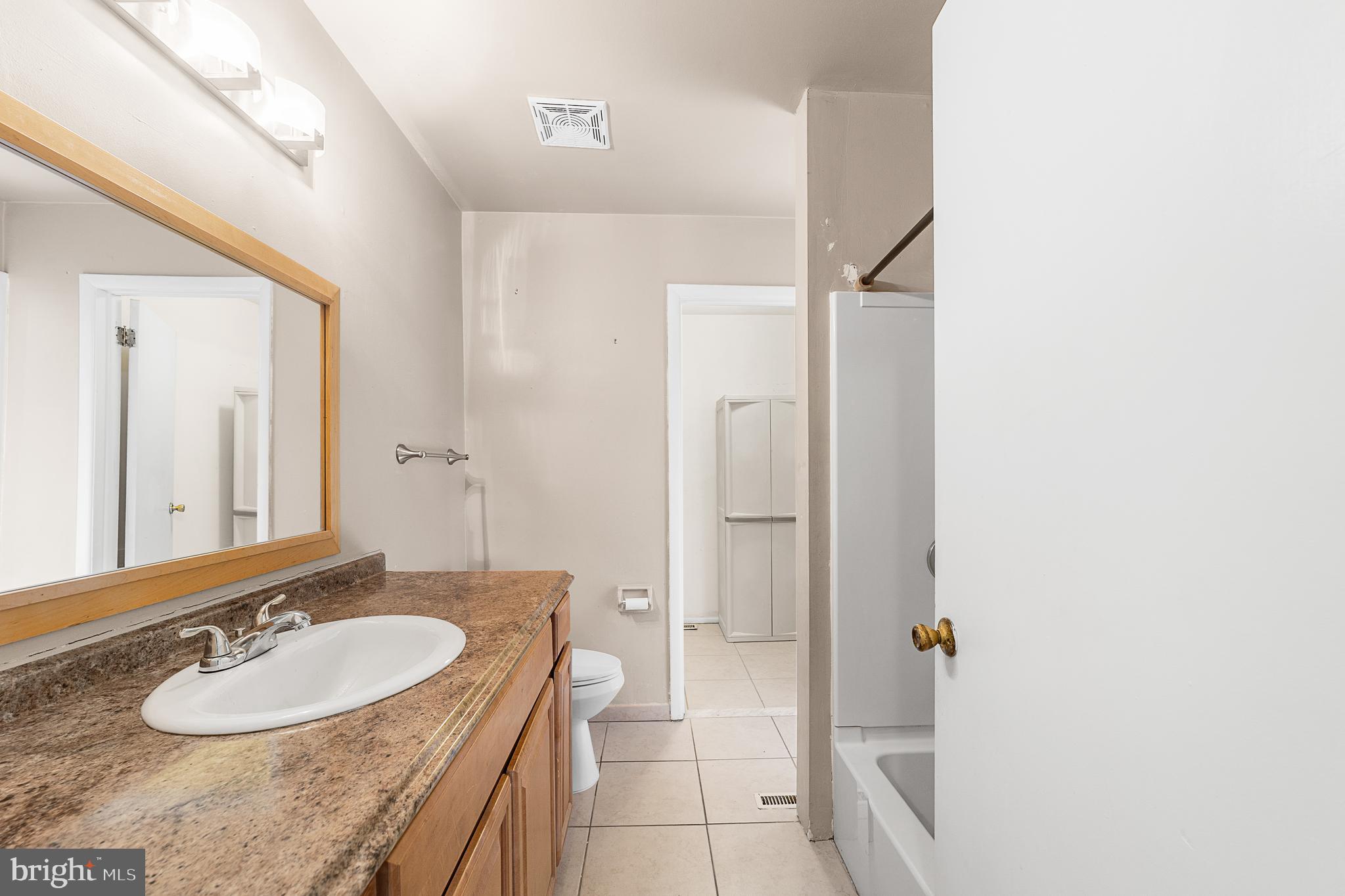 5 Dover Drive Lindenwold, NJ 08021 - Photo 20 of 28 a bathroom with a granite countertop sink and a mirror