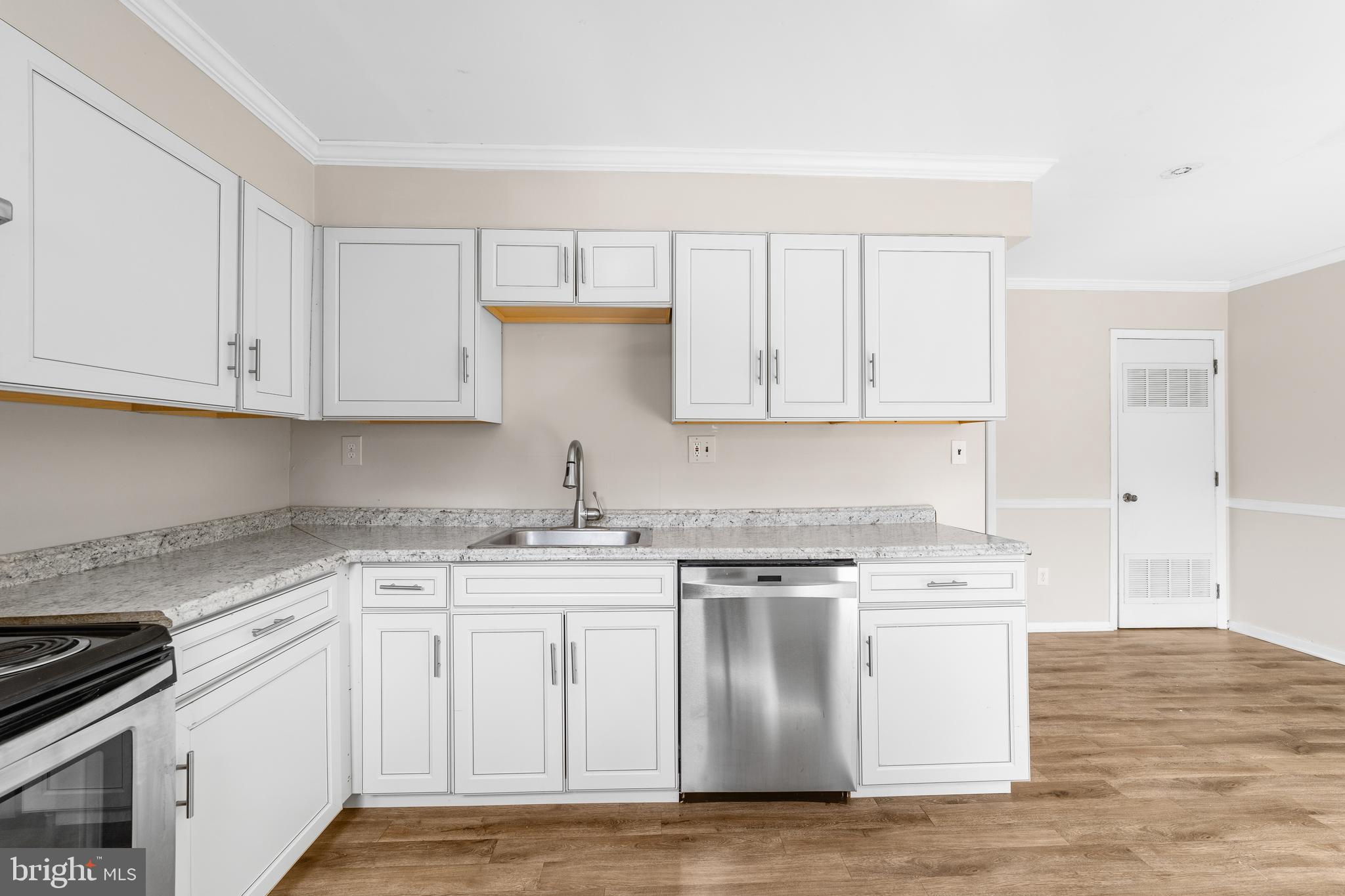 5 Dover Drive Lindenwold, NJ 08021 - Photo 10 of 28 a kitchen with white cabinets stainless steel appliances and sink