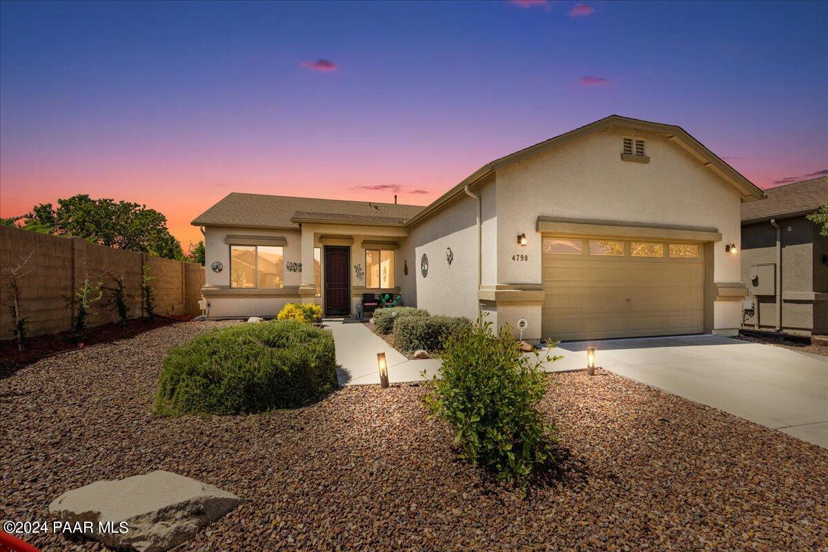 4798 Edgemont Road Prescott Valley, AZ 86314 - Photo 1 of 22 a front view of a house with garden