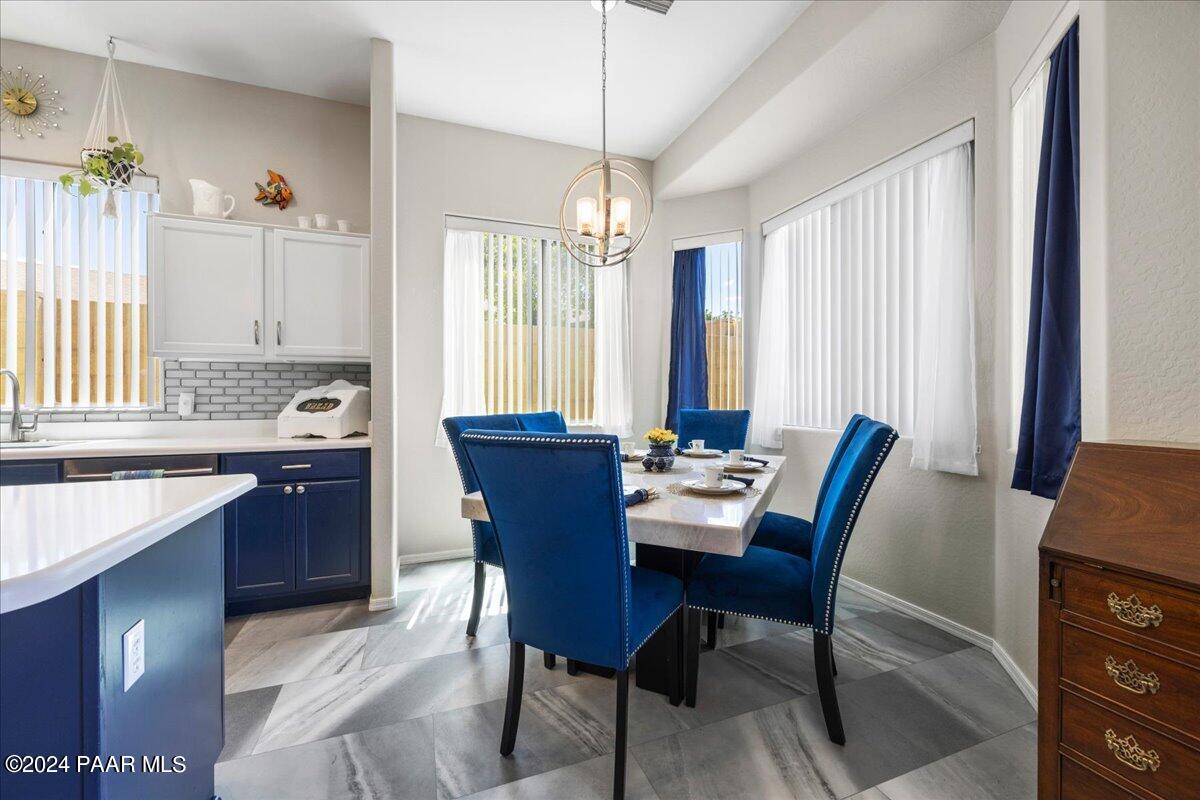 4798 Edgemont Road Prescott Valley, AZ 86314 - Photo 8 of 22 a view of a dining room with furniture and window