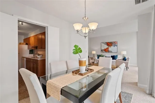 a kitchen with a sink stove top oven and cabinets