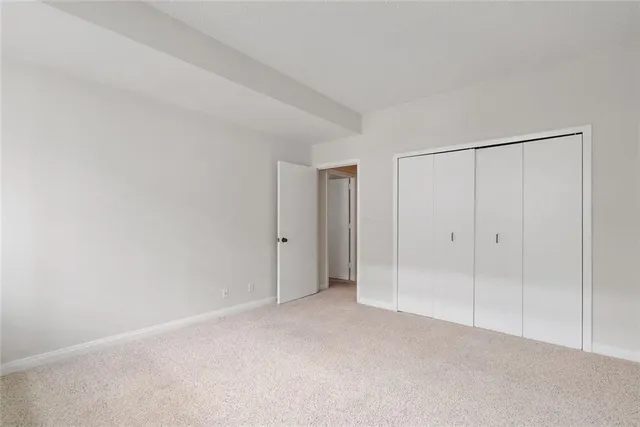 a view of a balcony with wooden floor and door