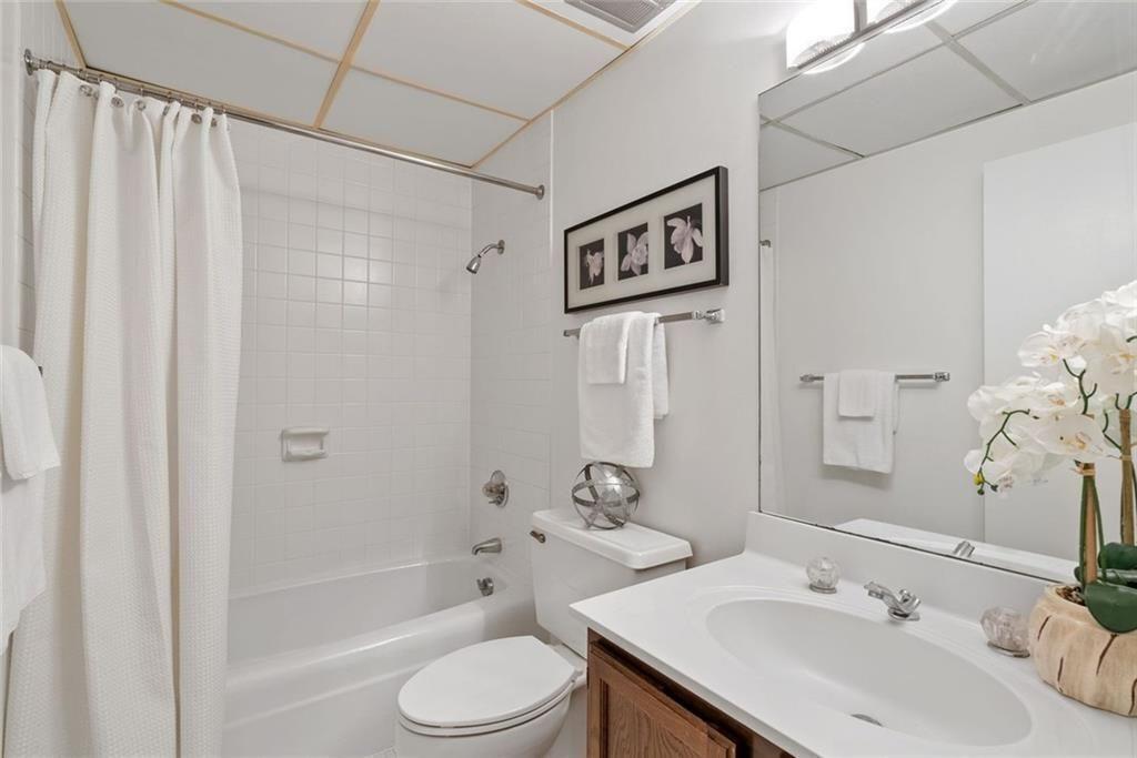 145 15th Street Northeast, Unit 602 Atlanta, GA 30361 - Photo 25 of 43 a bathroom with a sink toilet and shower