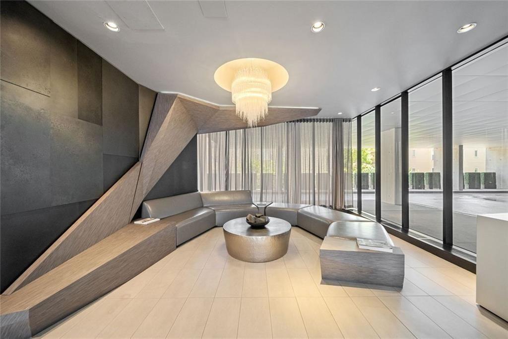 145 15th Street Northeast, Unit 602 Atlanta, GA 30361 - Photo 32 of 43 a living room with furniture and a large window