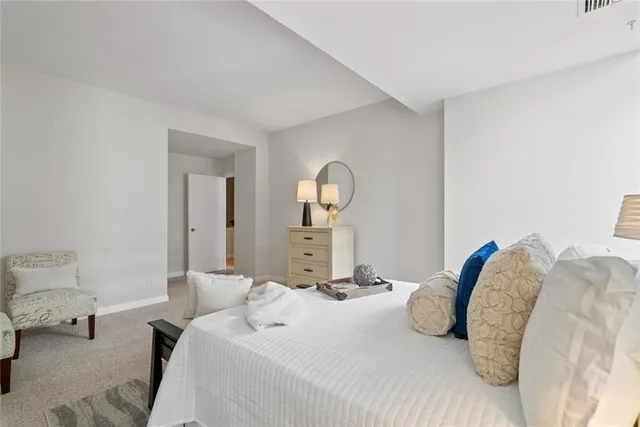 a bathroom with a sink a light fixture and a mirror