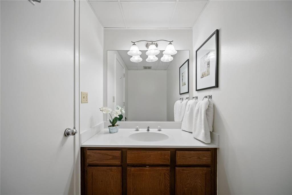 145 15th Street Northeast, Unit 602 Atlanta, GA 30361 - Photo 36 of 43 a bathroom with a sink and a mirror
