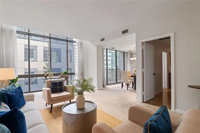 a living room with furniture and a large window