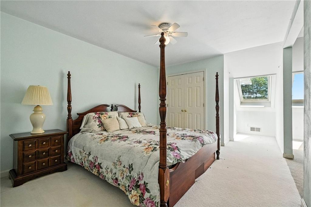 341 Paris Colliers Road Burgettstown, PA 15021 - Photo 17 of 37 a bedroom with a bed and a chandelier