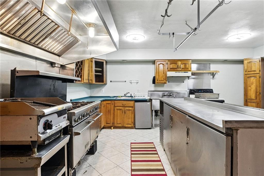 341 Paris Colliers Road Burgettstown, PA 15021 - Photo 26 of 37 a kitchen with a sink appliances and cabinets