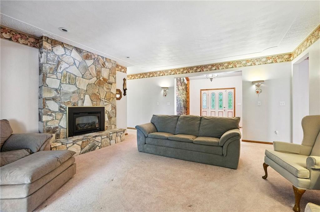341 Paris Colliers Road Burgettstown, PA 15021 - Photo 6 of 37 a living room with furniture and a fireplace