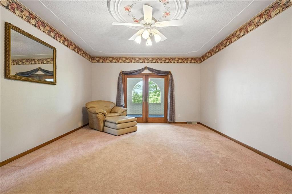 341 Paris Colliers Road Burgettstown, PA 15021 - Photo 8 of 37 en empty room with windows and chandelier