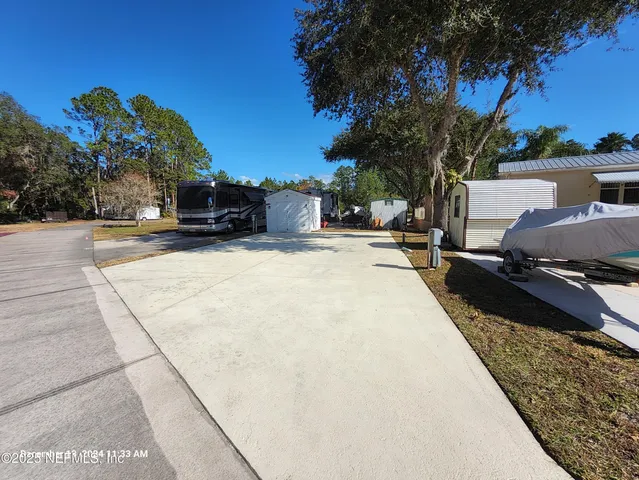 a view of a swimming pool with a yard