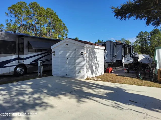 a view of a car park in front of house