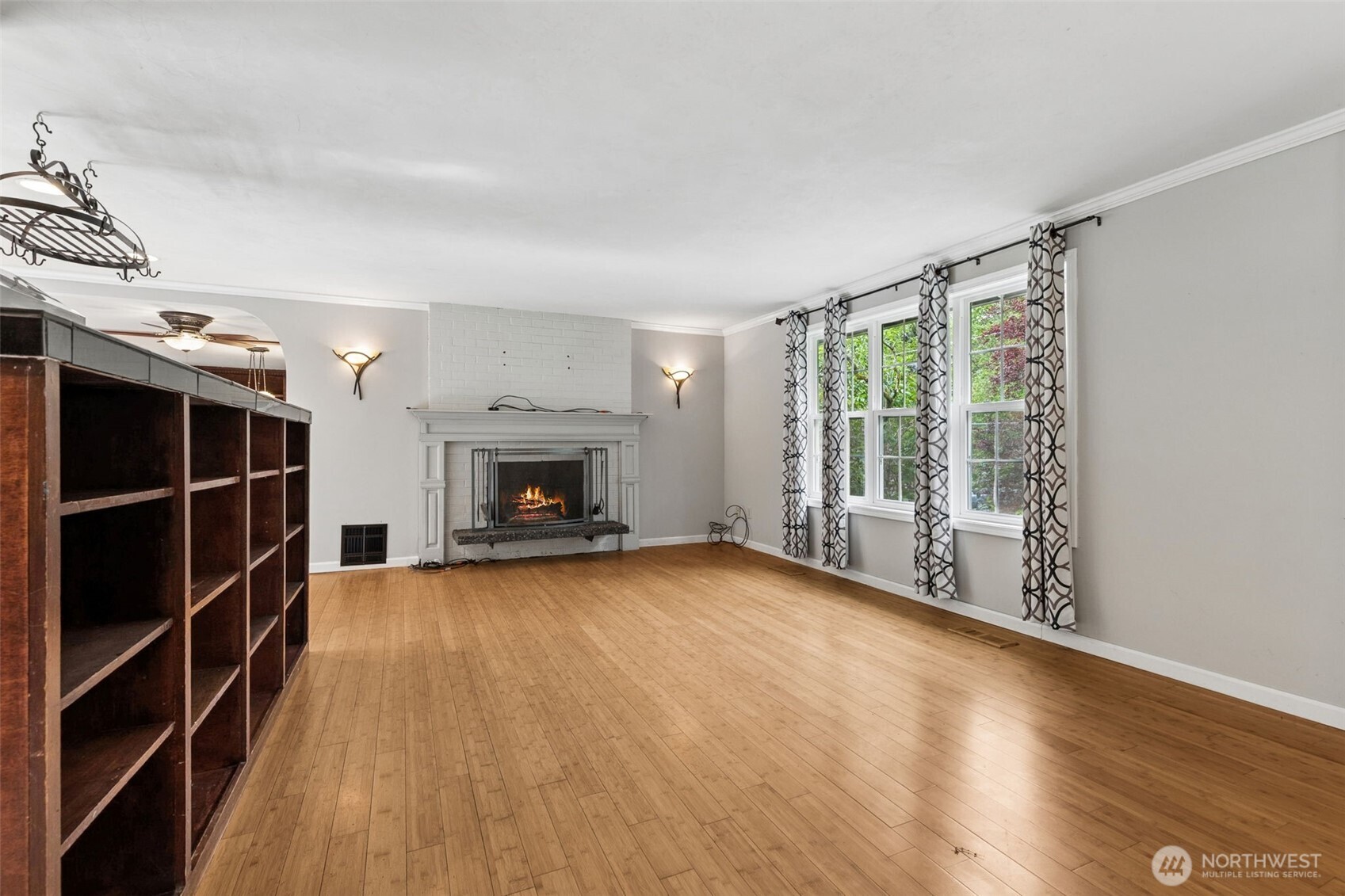 608 School Street Southeast Lacey, WA 98503 - Photo 12 of 26 wooden floor fireplace and windows in an empty room