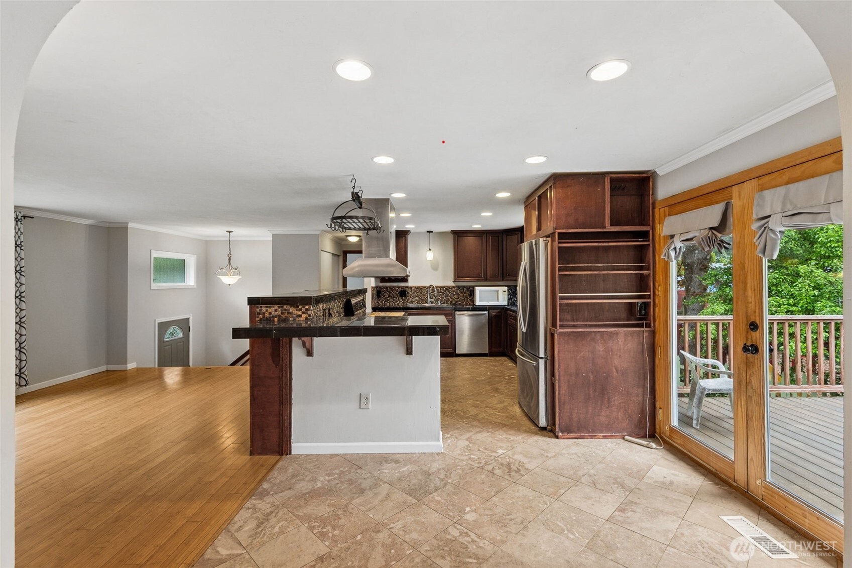 608 School Street Southeast Lacey, WA 98503 - Photo 14 of 26 a kitchen with stainless steel appliances kitchen island granite countertop a refrigerator and a sink