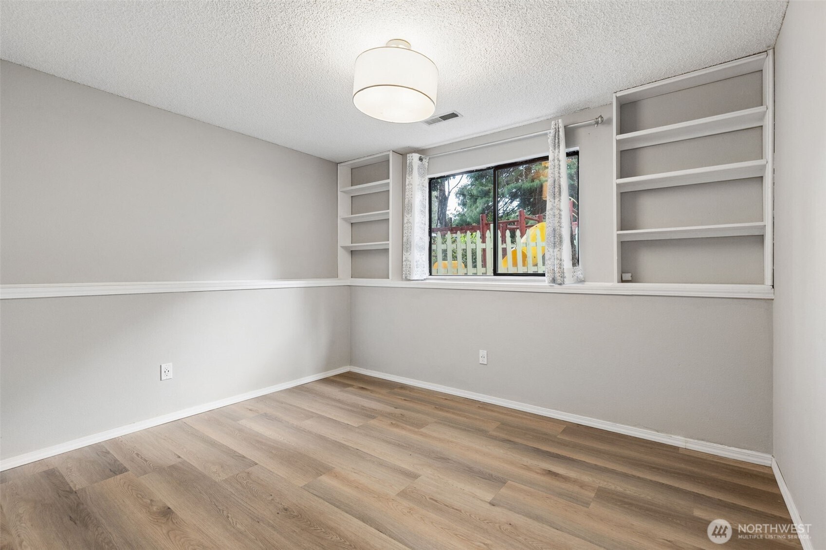 608 School Street Southeast Lacey, WA 98503 - Photo 17 of 26 a view of an empty room with a window