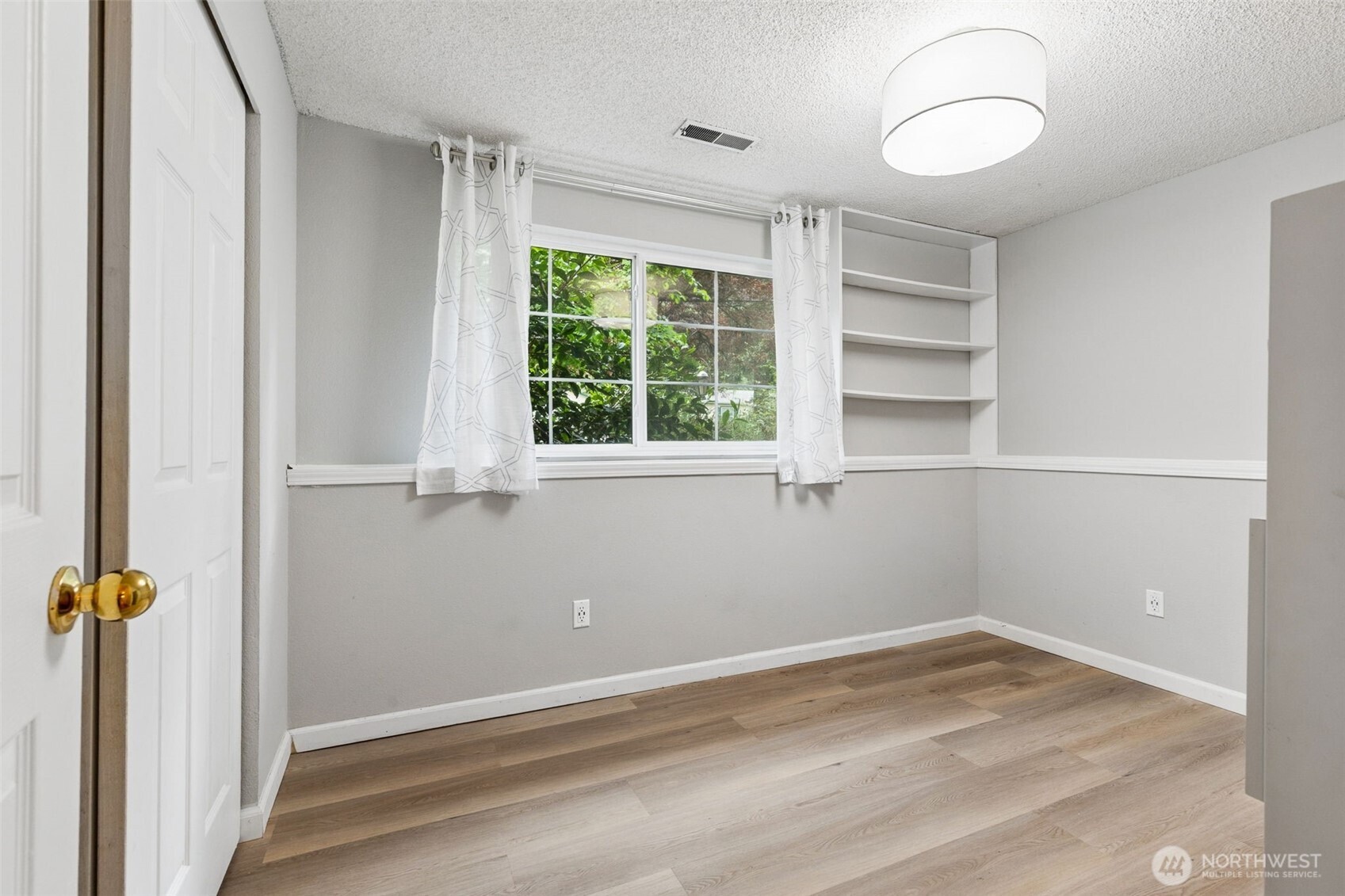 608 School Street Southeast Lacey, WA 98503 - Photo 19 of 26 wooden floor in an empty room with a window