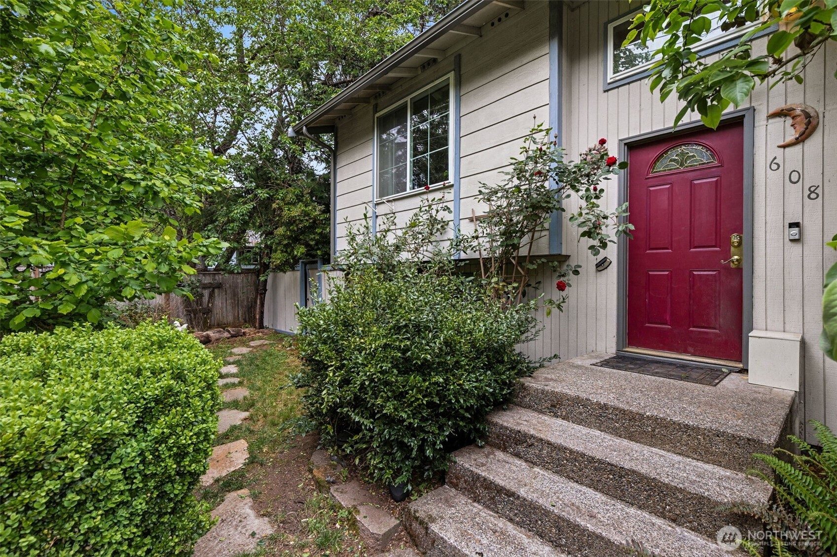 608 School Street Southeast Lacey, WA 98503 - Photo 2 of 26 a front view of a house with a garden