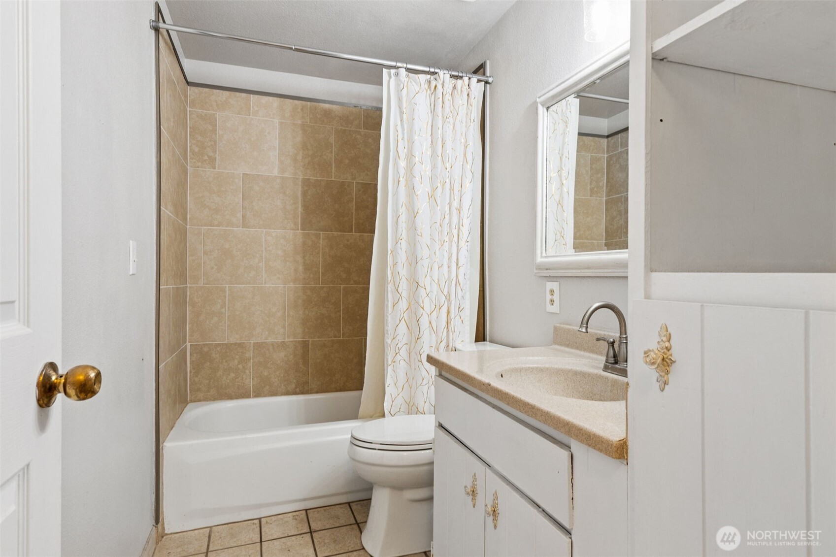 608 School Street Southeast Lacey, WA 98503 - Photo 21 of 26 a bathroom with a sink a toilet and a bathtub