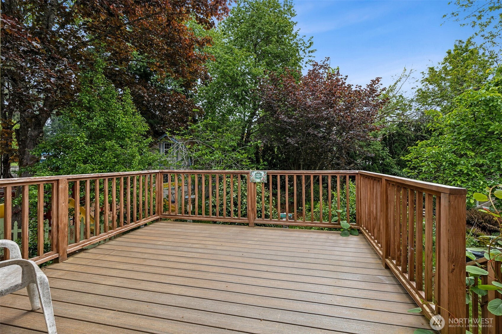 608 School Street Southeast Lacey, WA 98503 - Photo 23 of 26 a balcony with wooden floor and fence