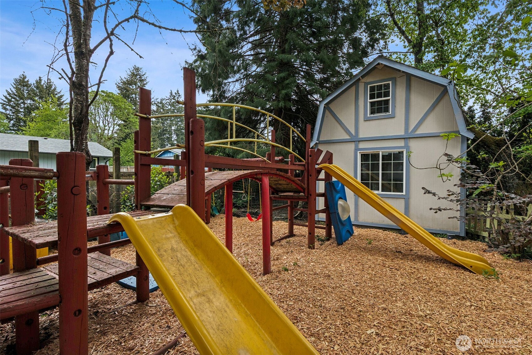608 School Street Southeast Lacey, WA 98503 - Photo 26 of 26 a view of a house with backyard and trees