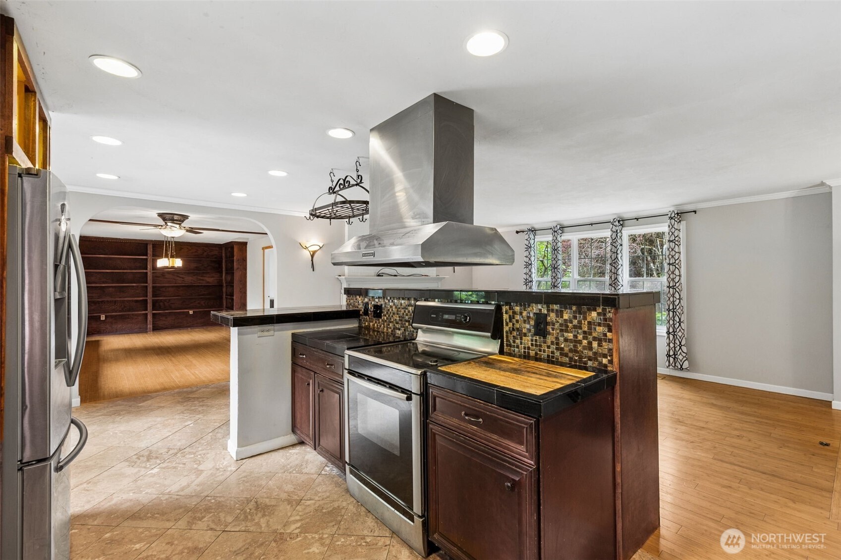608 School Street Southeast Lacey, WA 98503 - Photo 7 of 26 a kitchen with stainless steel appliances granite countertop a stove and a sink