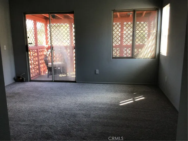 a view of empty room with windows