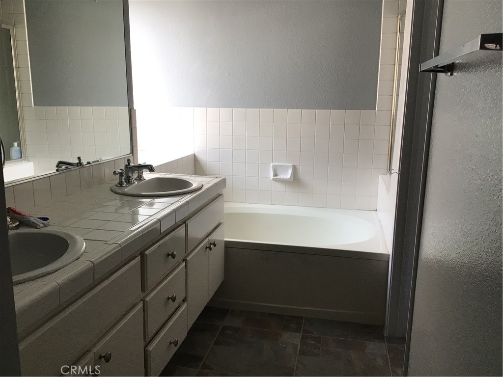 763 Anthirium Avenue Perris, CA 92571 - Photo 18 of 20 a bathroom with a sink and a mirror