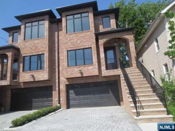 a front view of a house with a garage