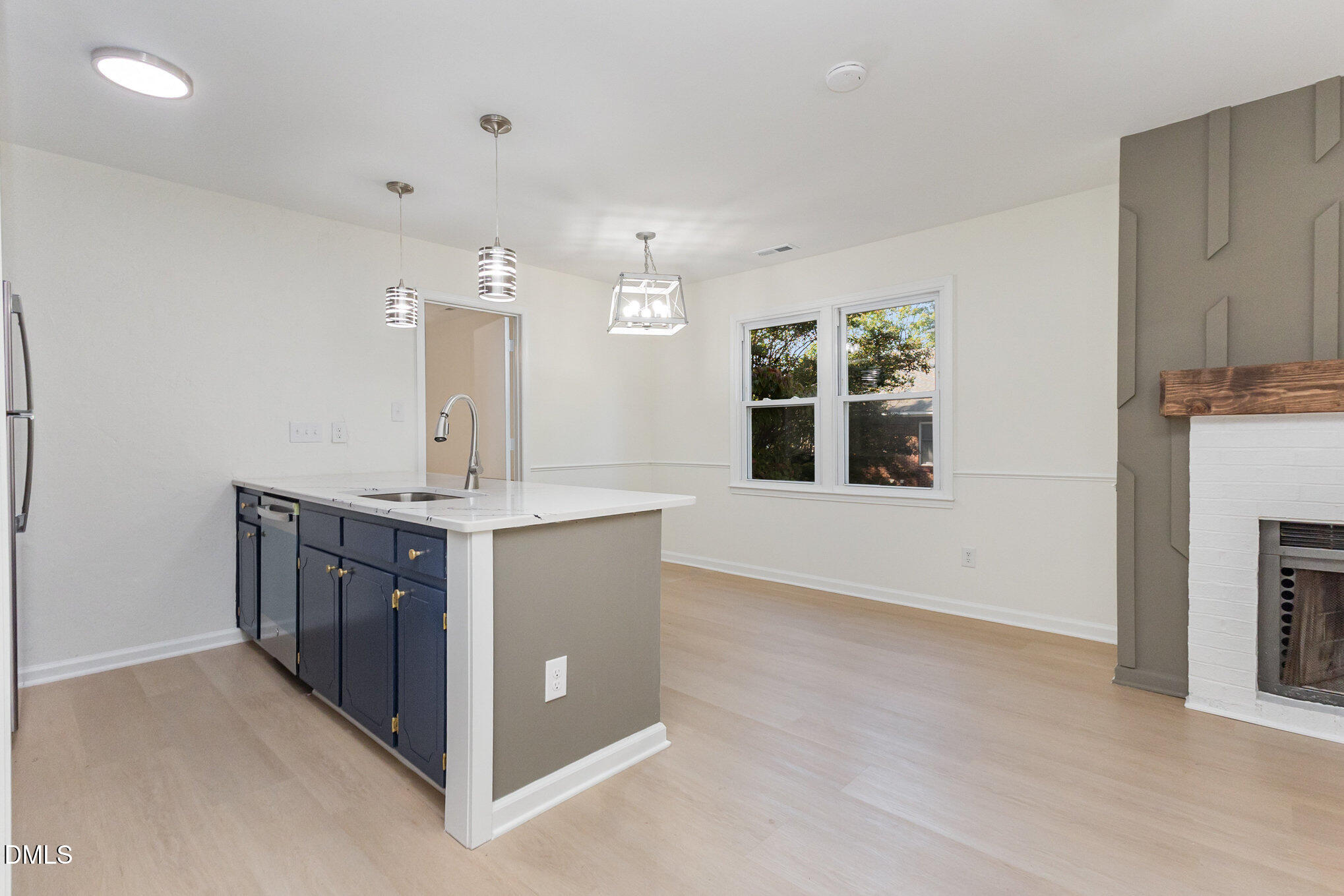 3559 Mill Run Raleigh, NC 27612 - Photo 10 of 28 a kitchen with stainless steel appliances granite countertop a stove and a sink