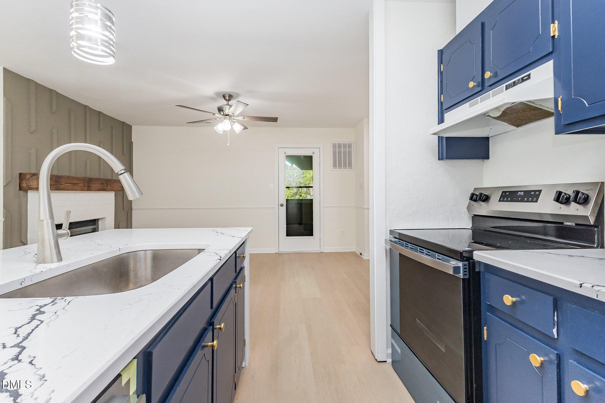 3559 Mill Run Raleigh, NC 27612 - Photo 12 of 28 a kitchen with stainless steel appliances granite countertop a sink a stove and a refrigerator