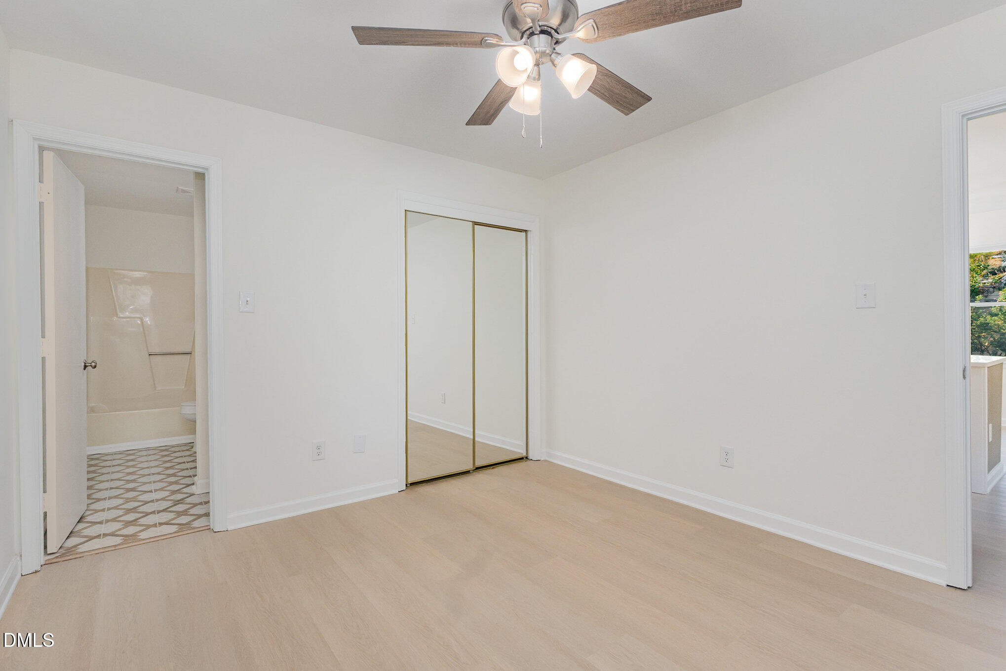 3559 Mill Run Raleigh, NC 27612 - Photo 16 of 28 an empty room with closet and fan