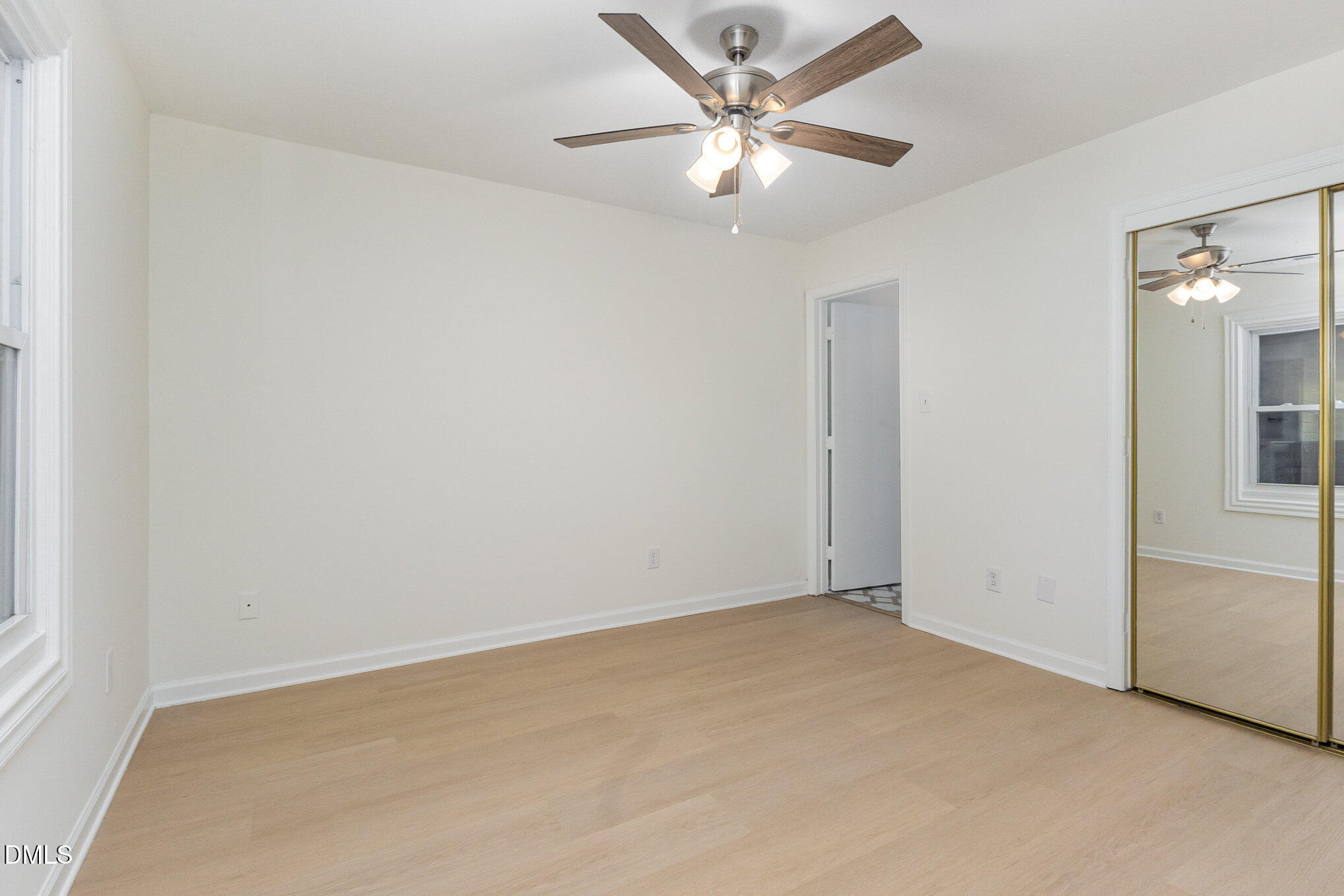 3559 Mill Run Raleigh, NC 27612 - Photo 17 of 28 an empty room with a chandelier fan