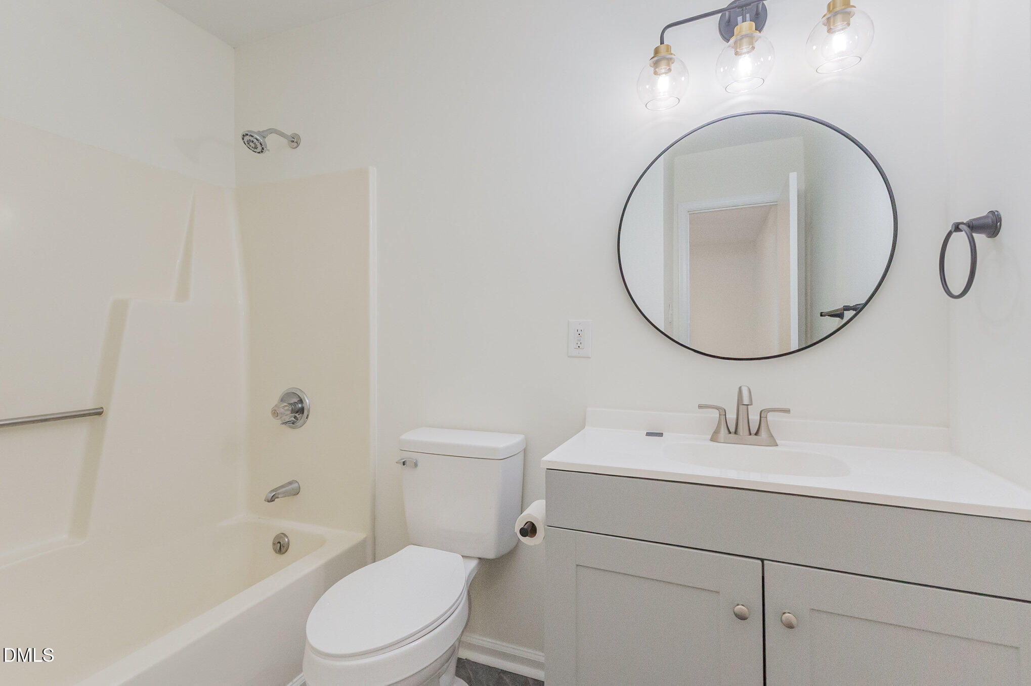 3559 Mill Run Raleigh, NC 27612 - Photo 21 of 28 a bathroom with a sink a toilet and a mirror