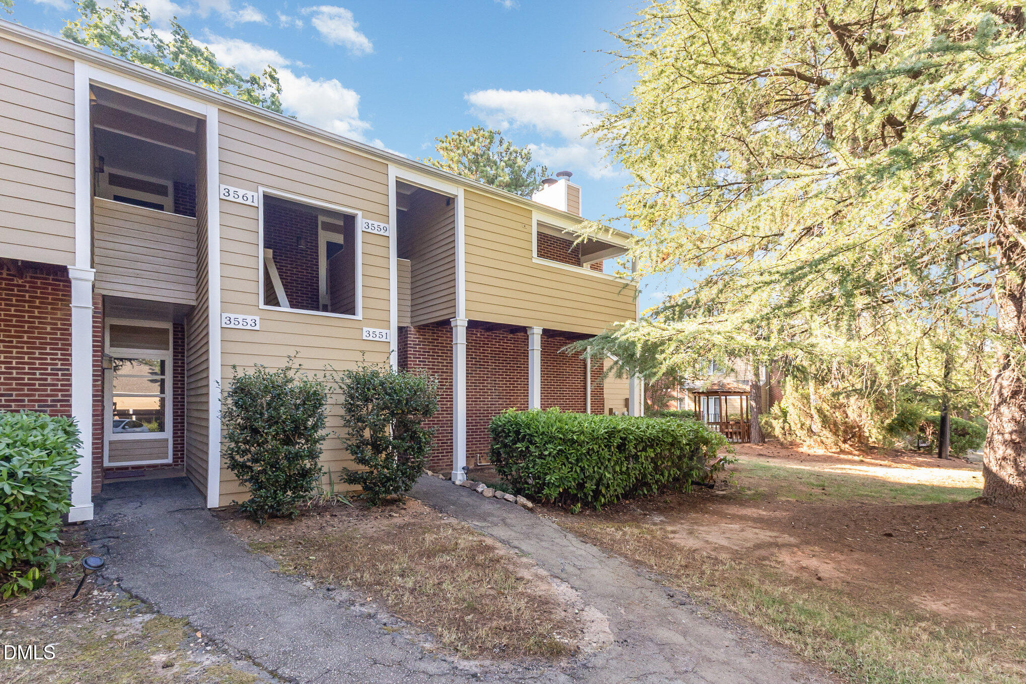 3559 Mill Run Raleigh, NC 27612 - Photo 25 of 28 a front view of a house with yard and trees