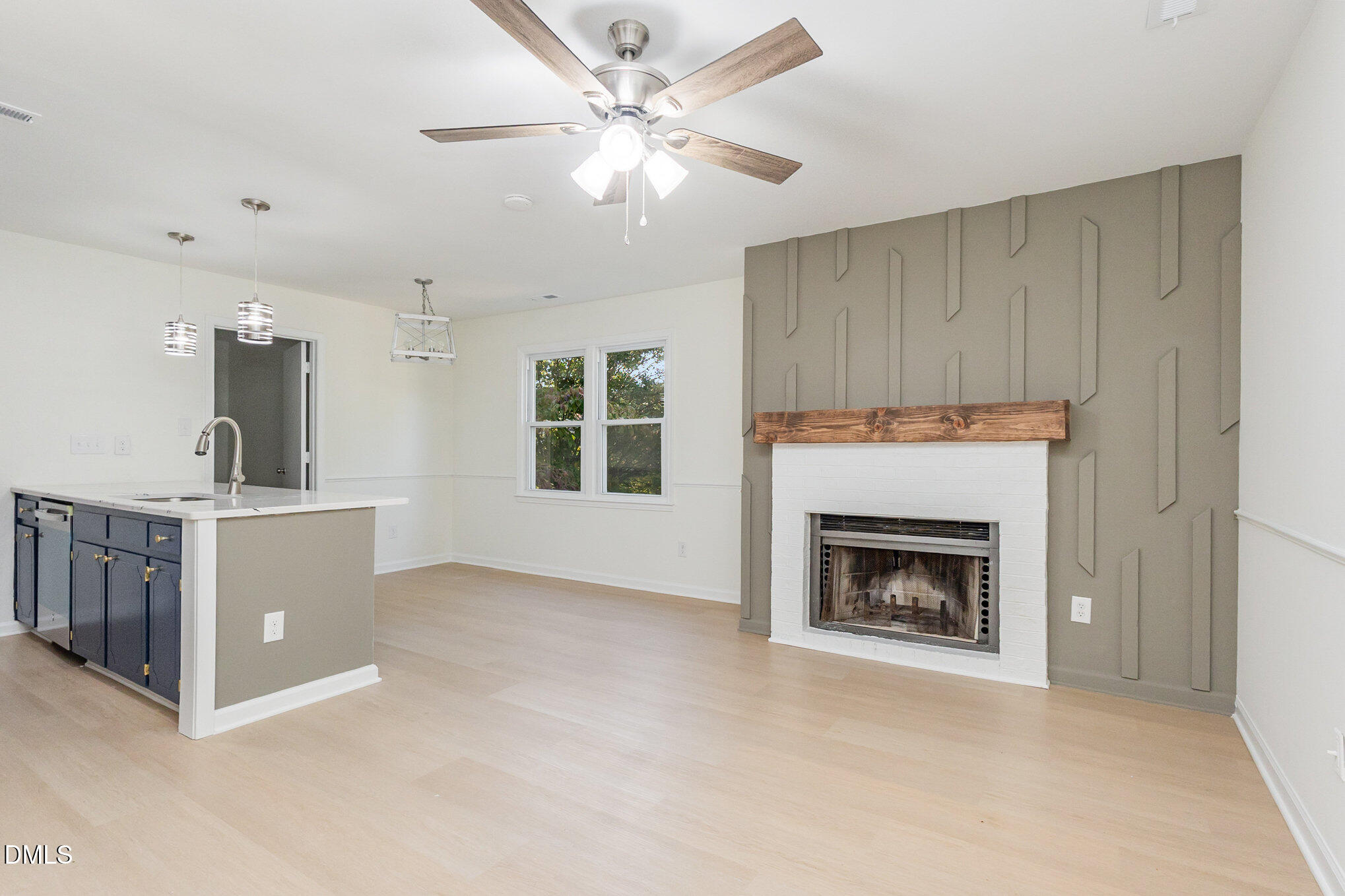 3559 Mill Run Raleigh, NC 27612 - Photo 5 of 28 a living room with furniture and a fireplace