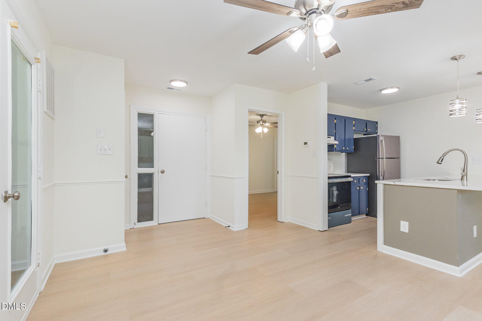 3559 Mill Run Raleigh, NC 27612 - Photo 7 of 28 a view of a kitchen with a sink and a refrigerator