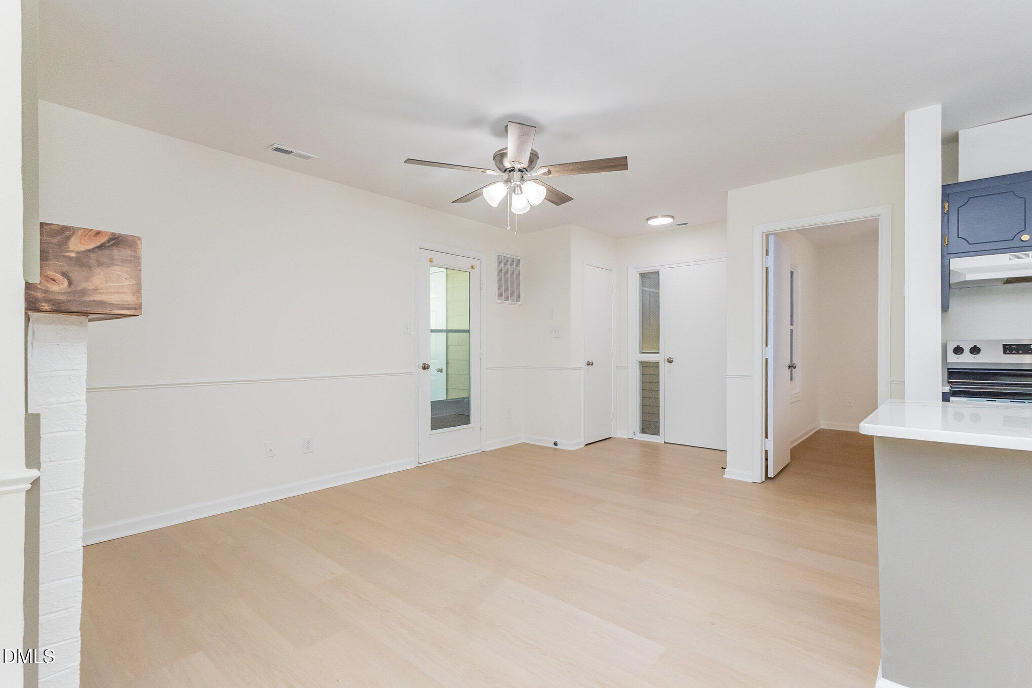 3559 Mill Run Raleigh, NC 27612 - Photo 8 of 28 a view of a kitchen with a sink and a refrigerator