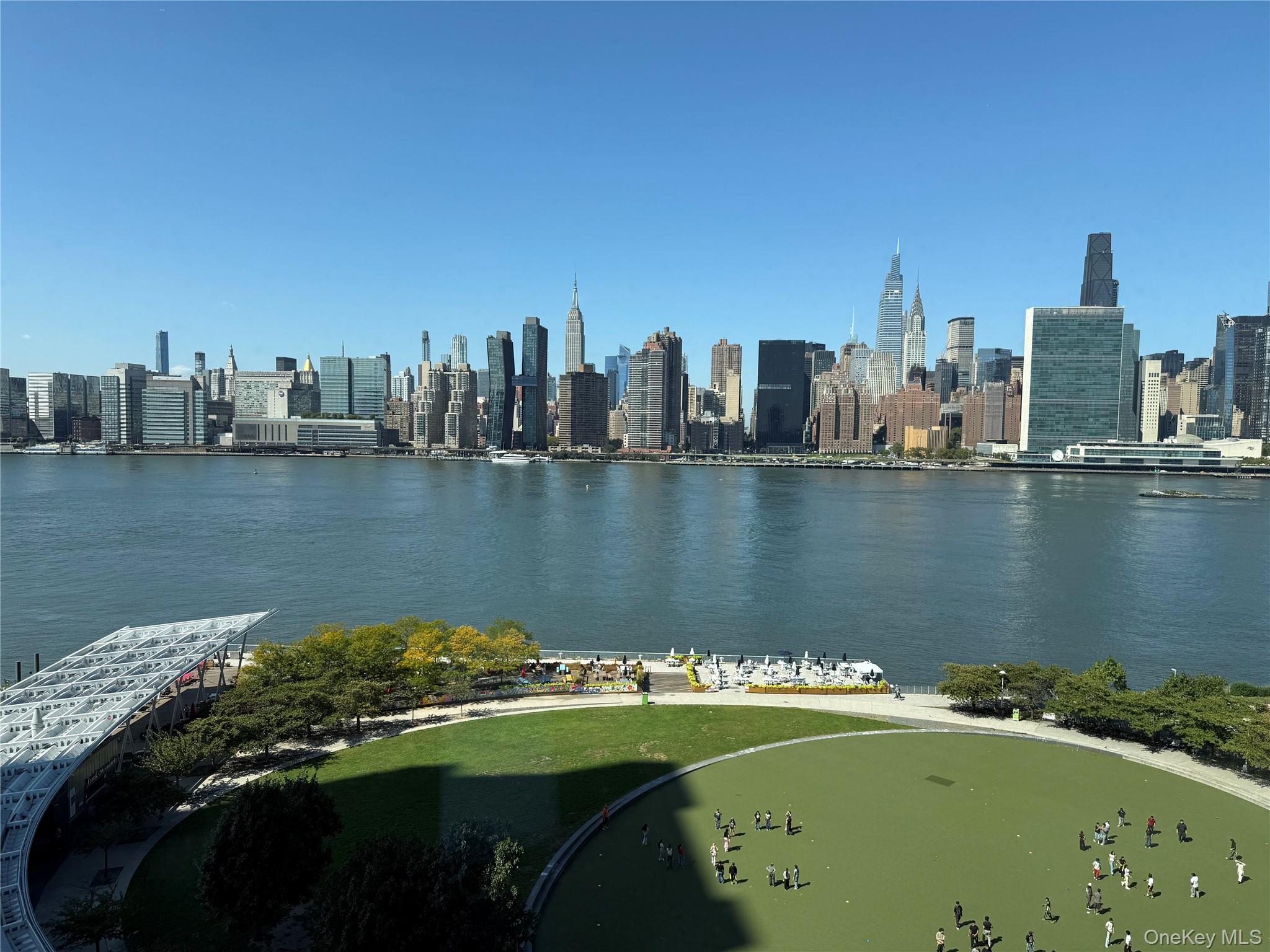 52-03 Center Boulevard, Unit 928 Queens, NY 11101 - Photo 1 of 13 a view of a lake with a city
