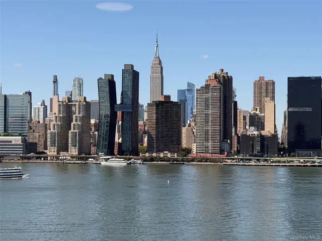 a view of water with tall building