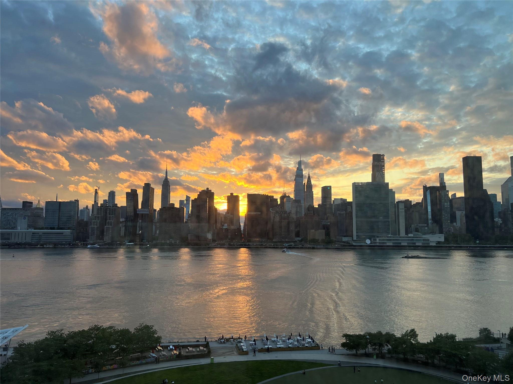 52-03 Center Boulevard, Unit 928 Queens, NY 11101 - Photo 12 of 13 a view of a lake with houses