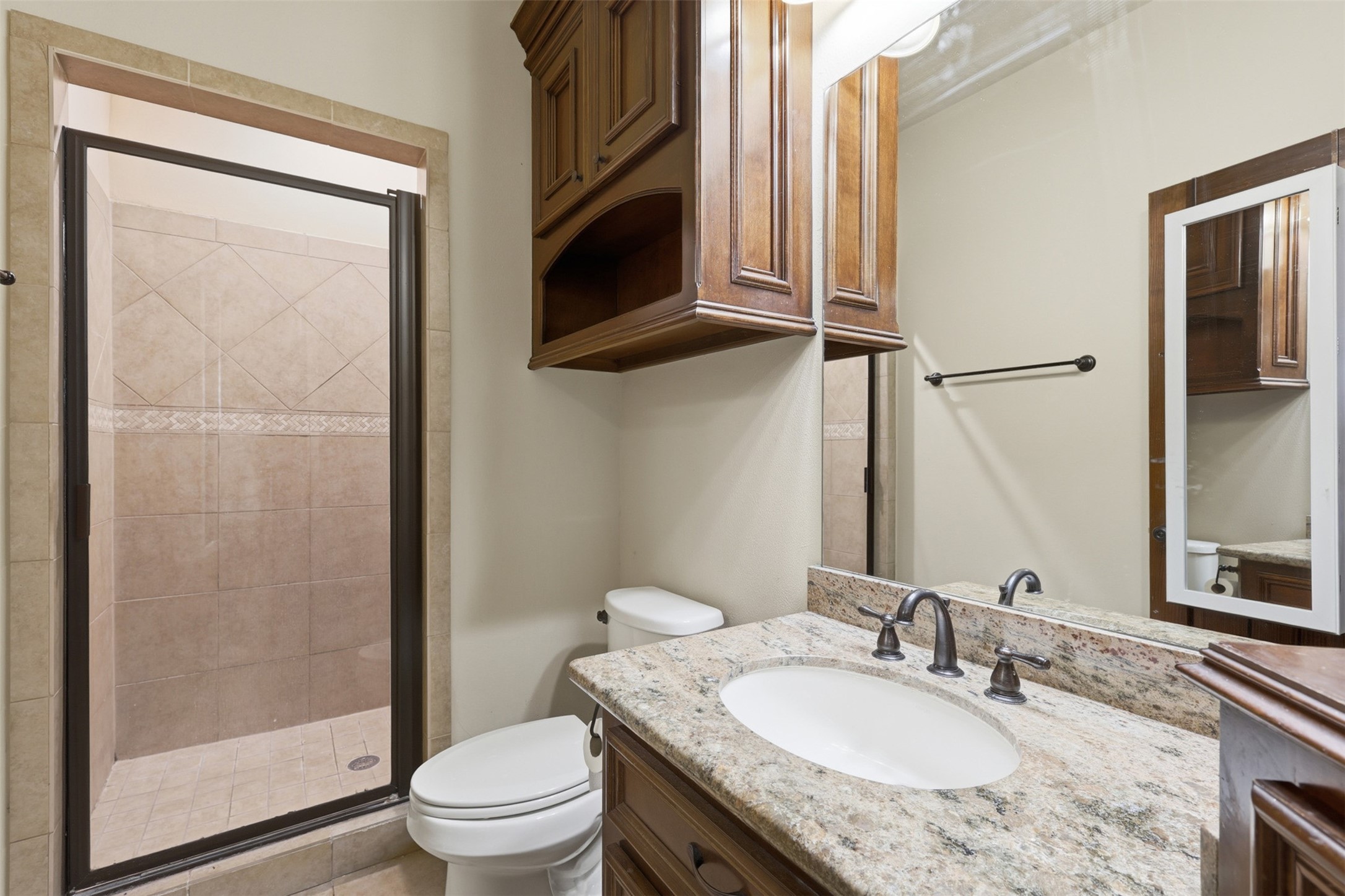 14 Post Shadow Estate Drive Spring, TX 77389 - Photo 32 of 49 a bathroom with a granite countertop sink toilet and shower