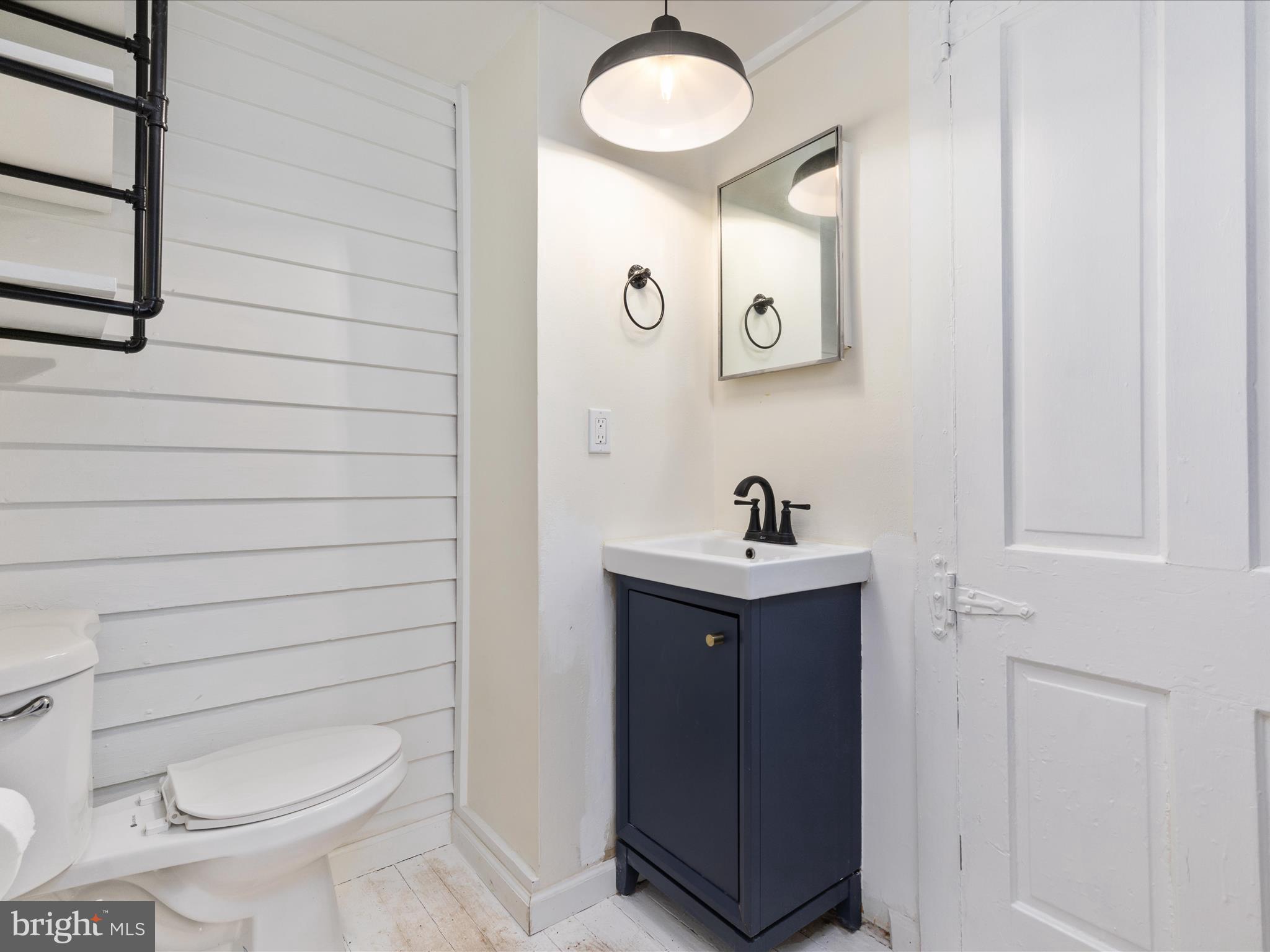 36610 Philomont Road Purcellville, VA 20132 - Photo 12 of 61 a bathroom with a toilet sink and mirror