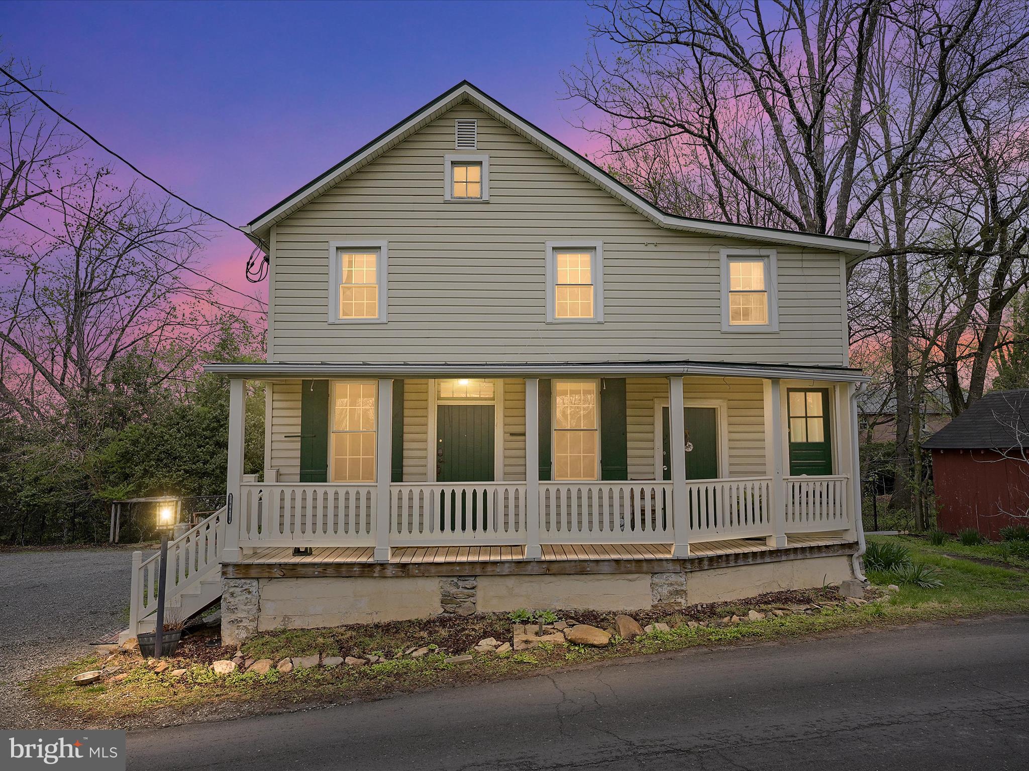 36610 Philomont Road Purcellville, VA 20132 - Photo 2 of 61 a view of a house with a small yard and wooden fence