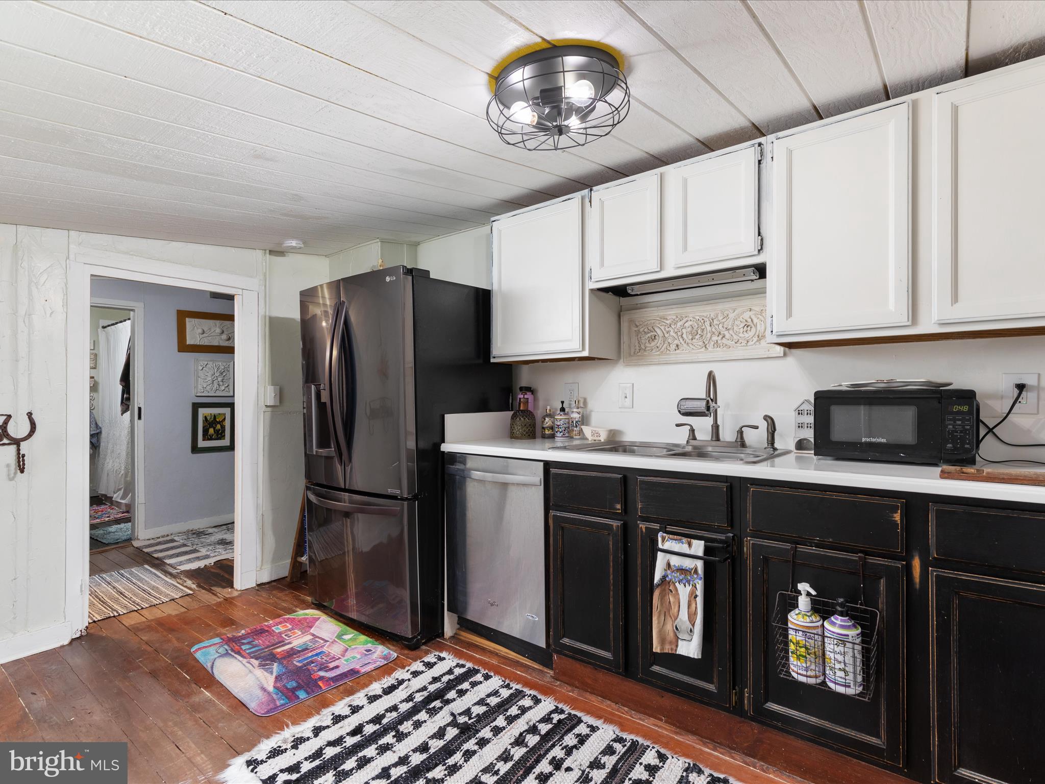 36610 Philomont Road Purcellville, VA 20132 - Photo 24 of 61 a kitchen with a refrigerator and a sink